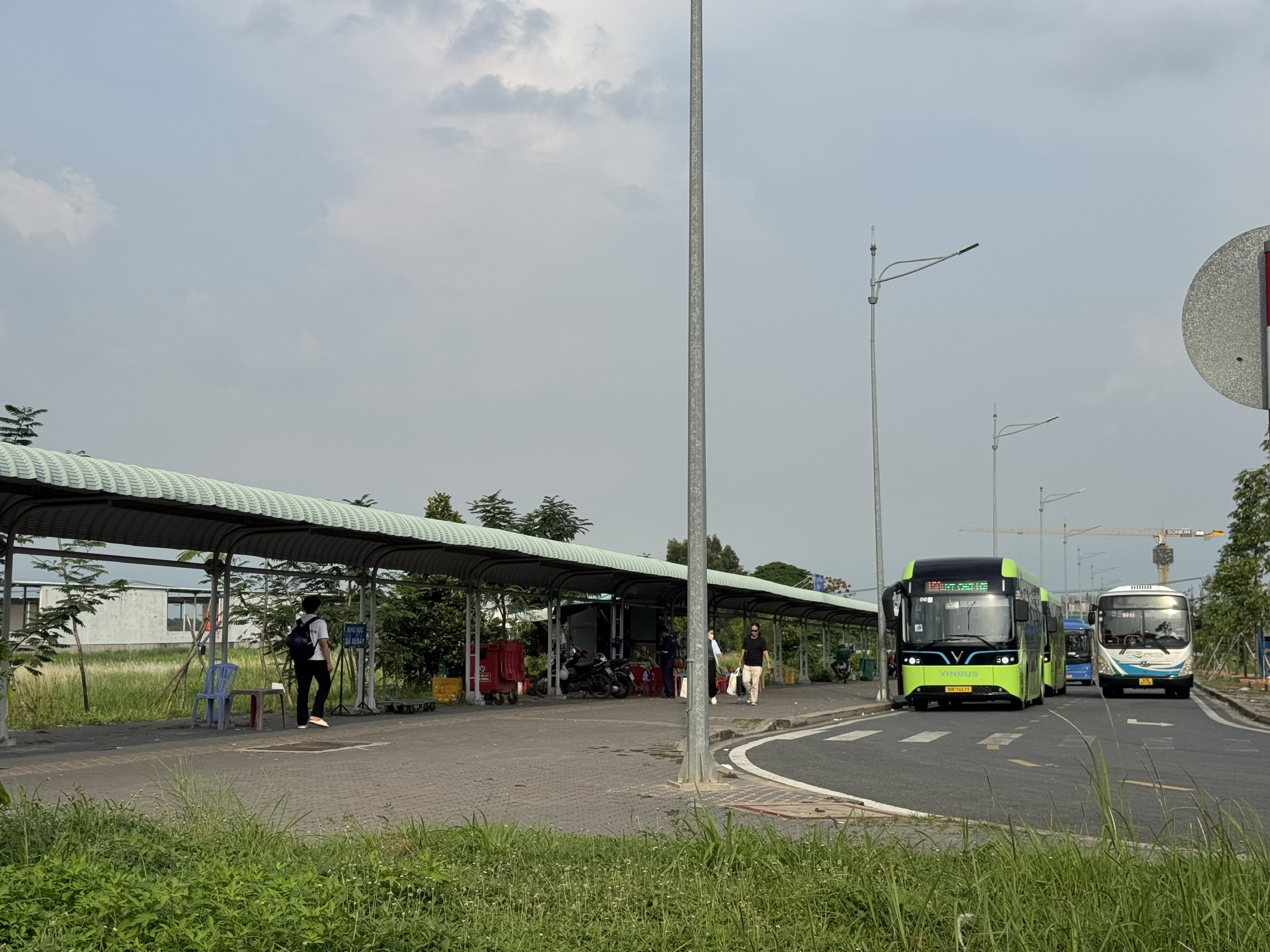 Bus stop for route 61-77 at New Mien Dong Bus Station
