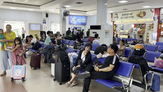 Passengers waiting for a train at Phu Thai Railway Station