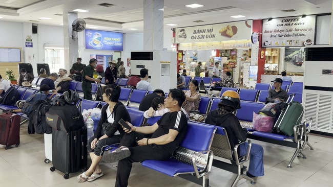 Passengers waiting for a train at Bao Ha Railway Station