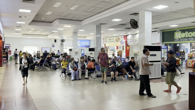 Passengers waiting for a train at Cho Sy Railway Station